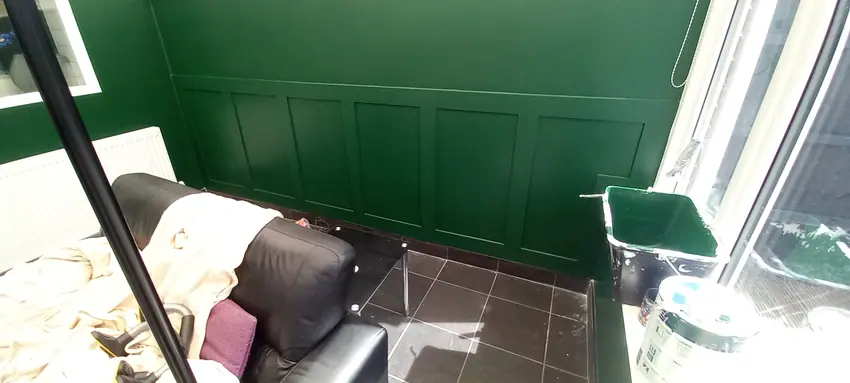 Green painted feature-wall panelling