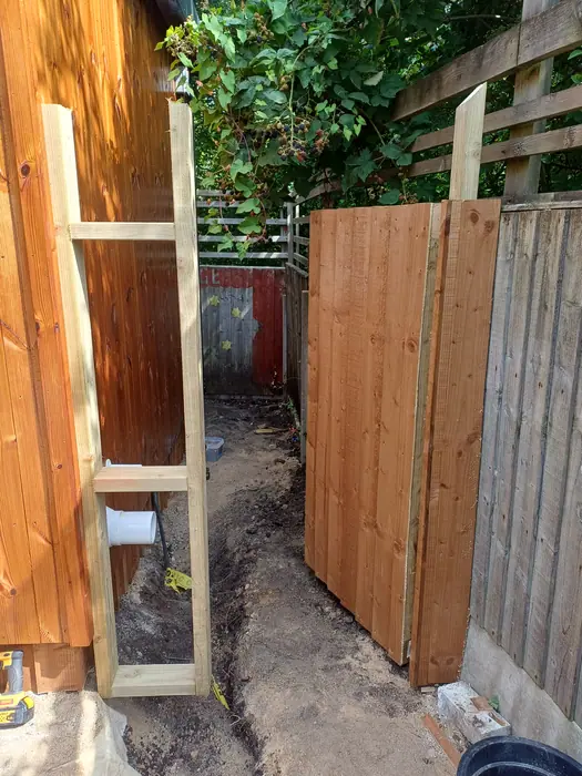 New timber gate installed in garden passage